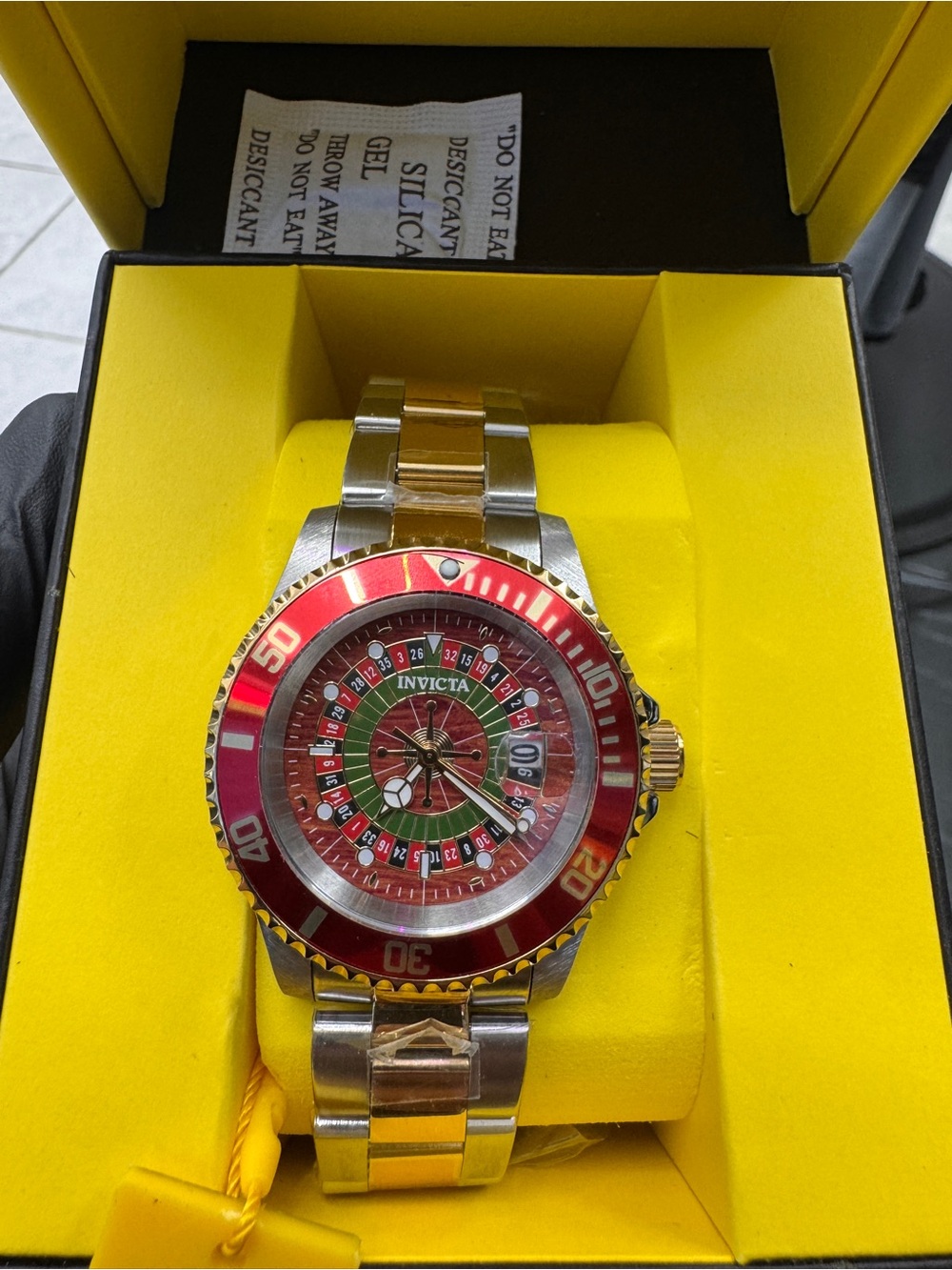 Invicta Two-Tone Stainless Steel Watch with Red Bezel and Multi-Color Dial